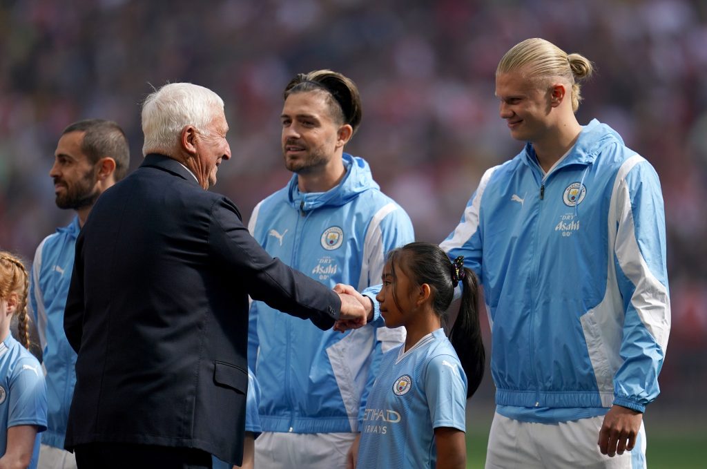 Mike Summerbee with Jack Grealish and Erling Haaland | Mike Summerbee will be featured in a new Manchester City statue at the Etihad Stadium in 2023
