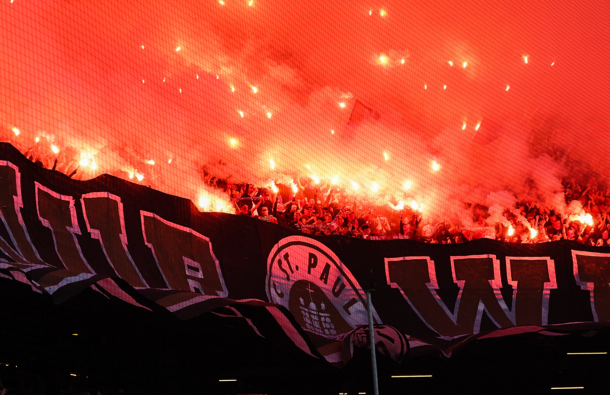 FC St. Pauli fans invade pitch after promotion to Bundesliga