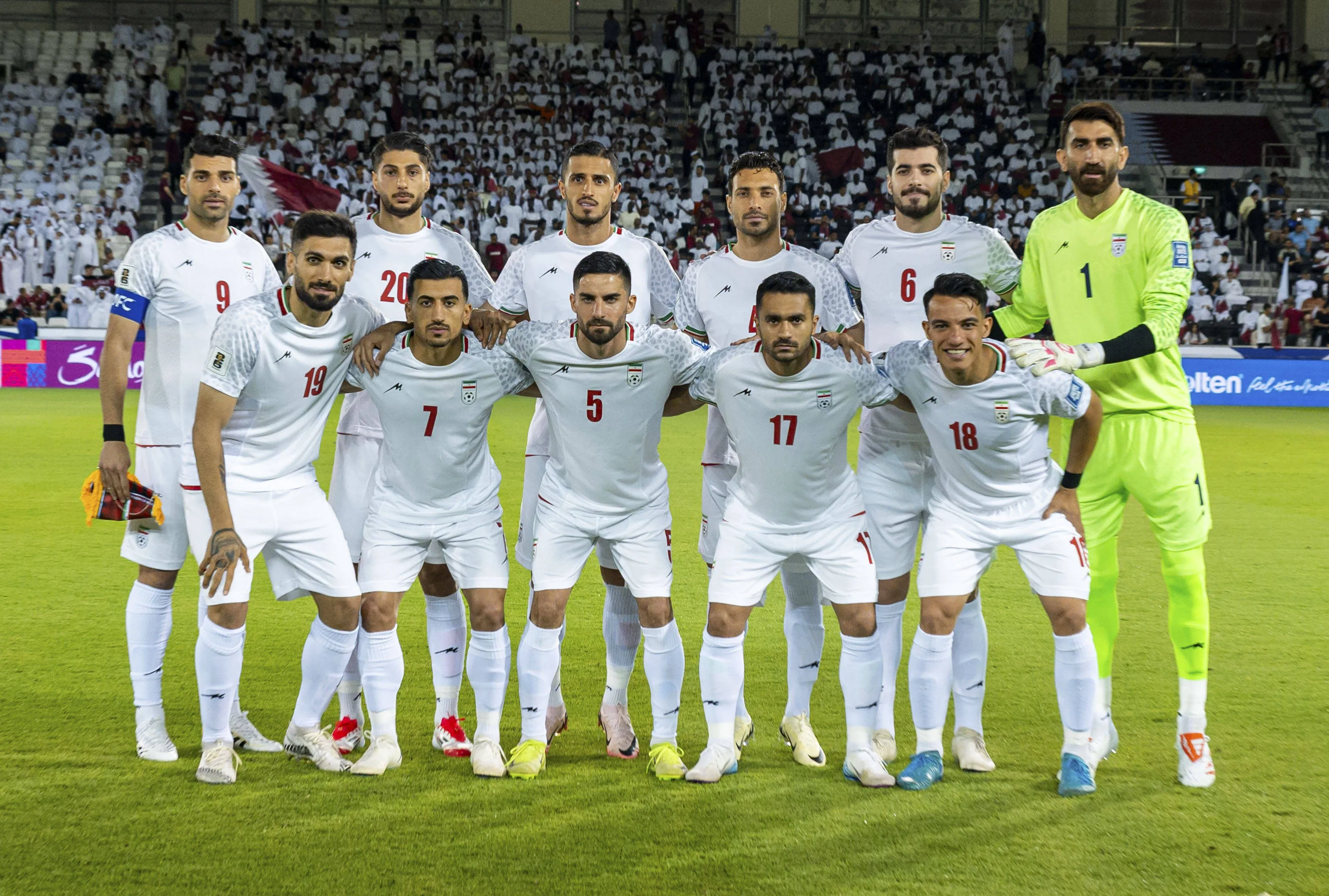 Players of Iran pose for a team photo during qualifier