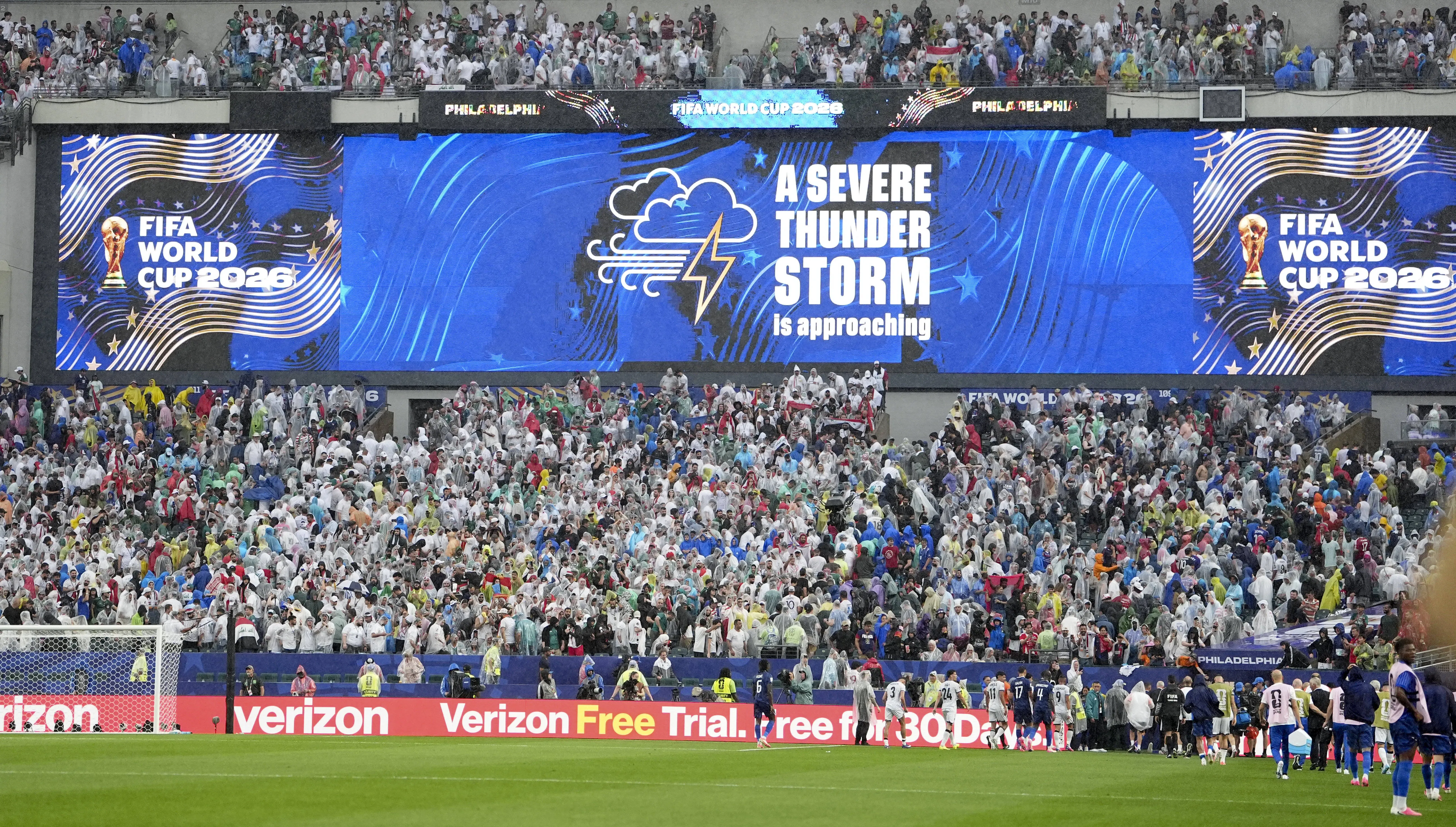 A screen shows a severe thunder storm warning during the group I match between France and Iraq at the 2026 World Cup