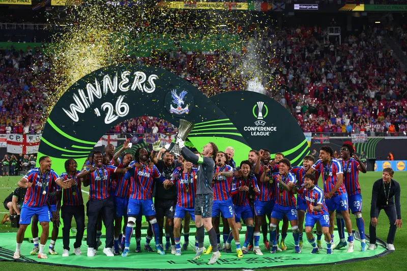 Crystal Palace players lift the UEFA Conference League trophy after beating Rayo Vallecano in the final