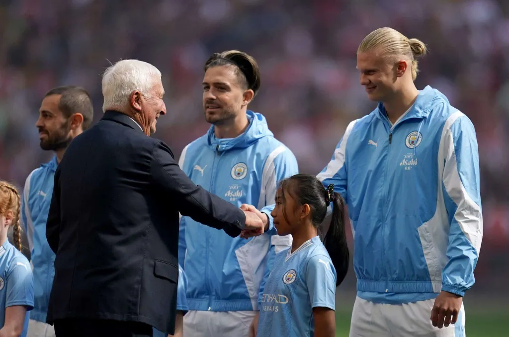 Mike Summerbee with Jack Grealish and Erling Haaland | Mike Summerbee will be featured in a new Manchester City statue at the Etihad Stadium in 2023