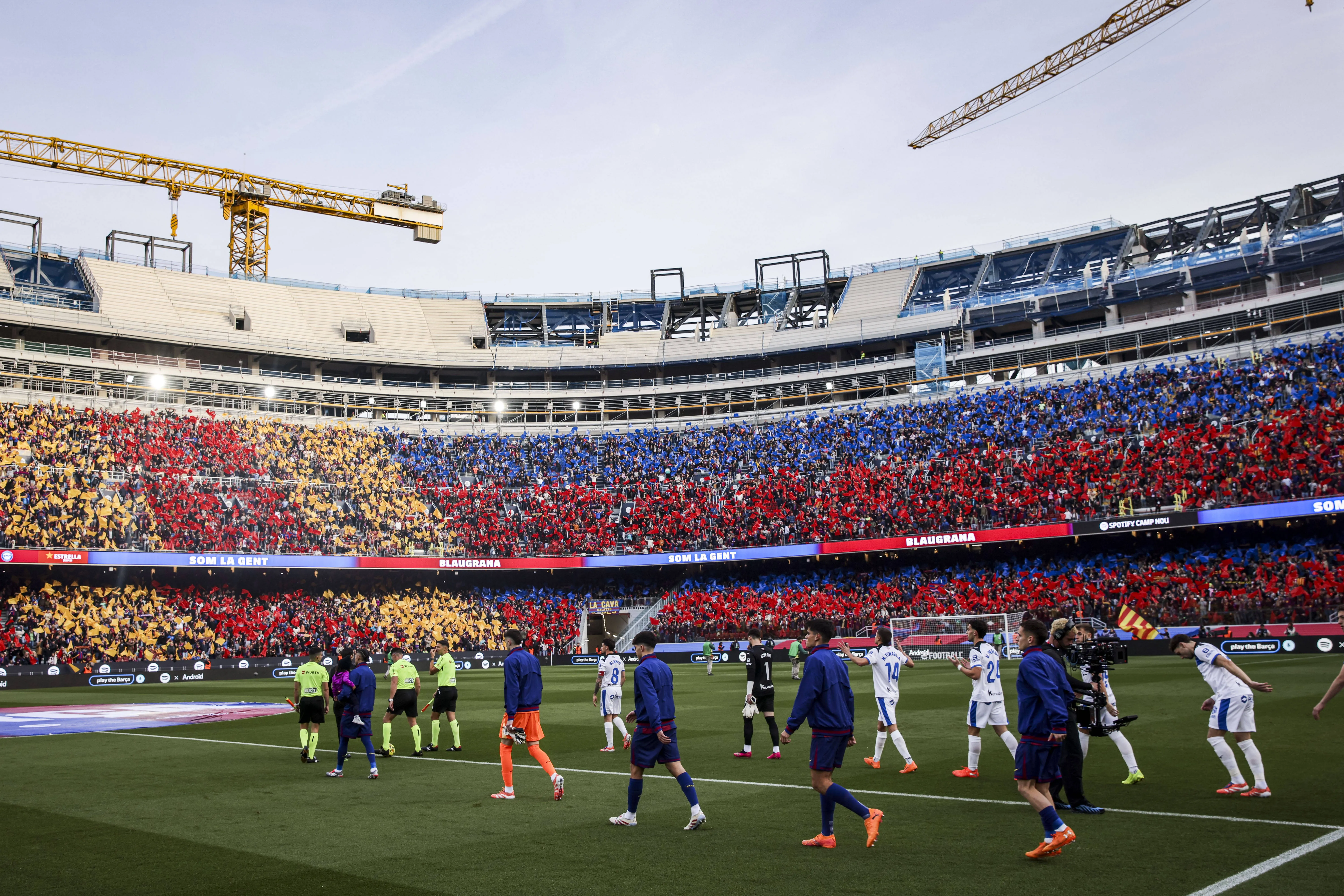 Players walk out at the Camp Nou