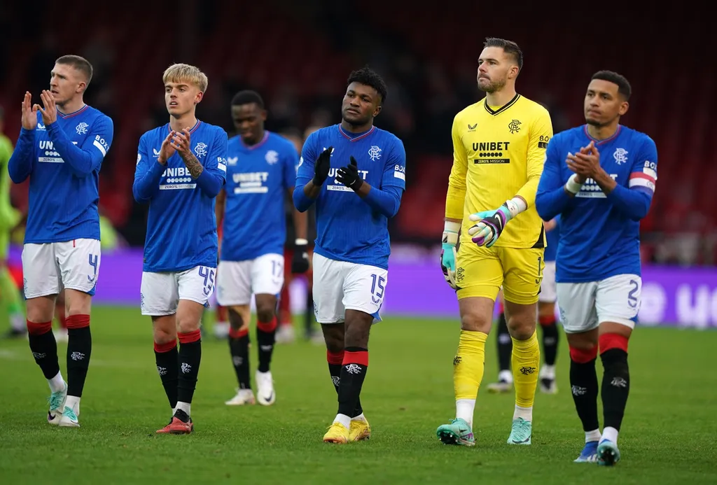 Rangers players applauding their away fans