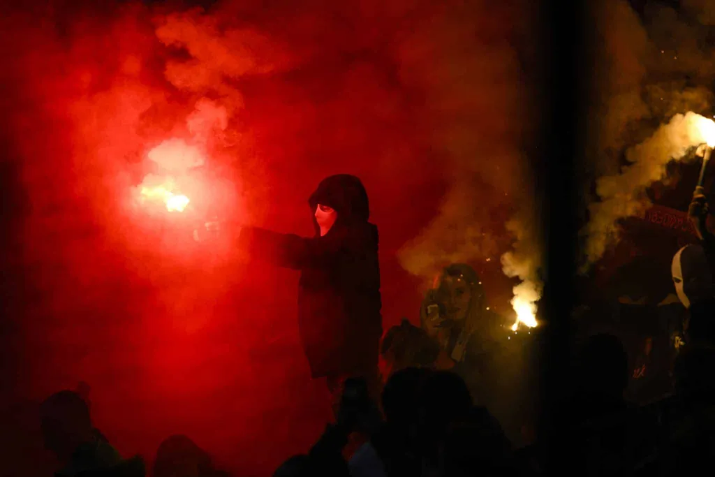 Football fans with flares, an activity often seen as 'hooligan'-like, but you won't see any flares in Green Street Hooligans