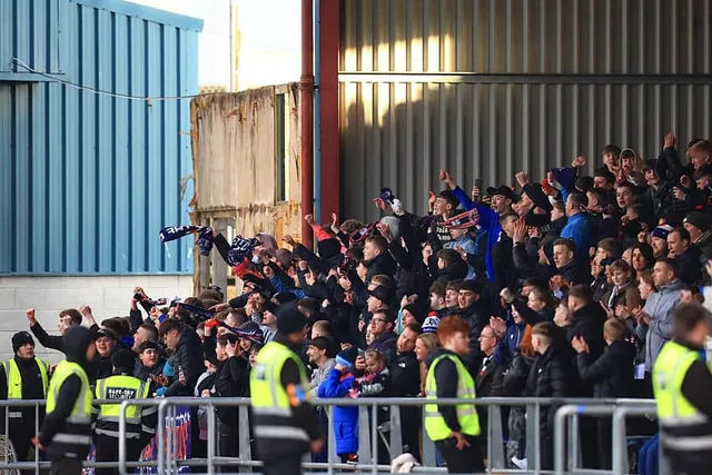 Fans in the stand at Dens Park