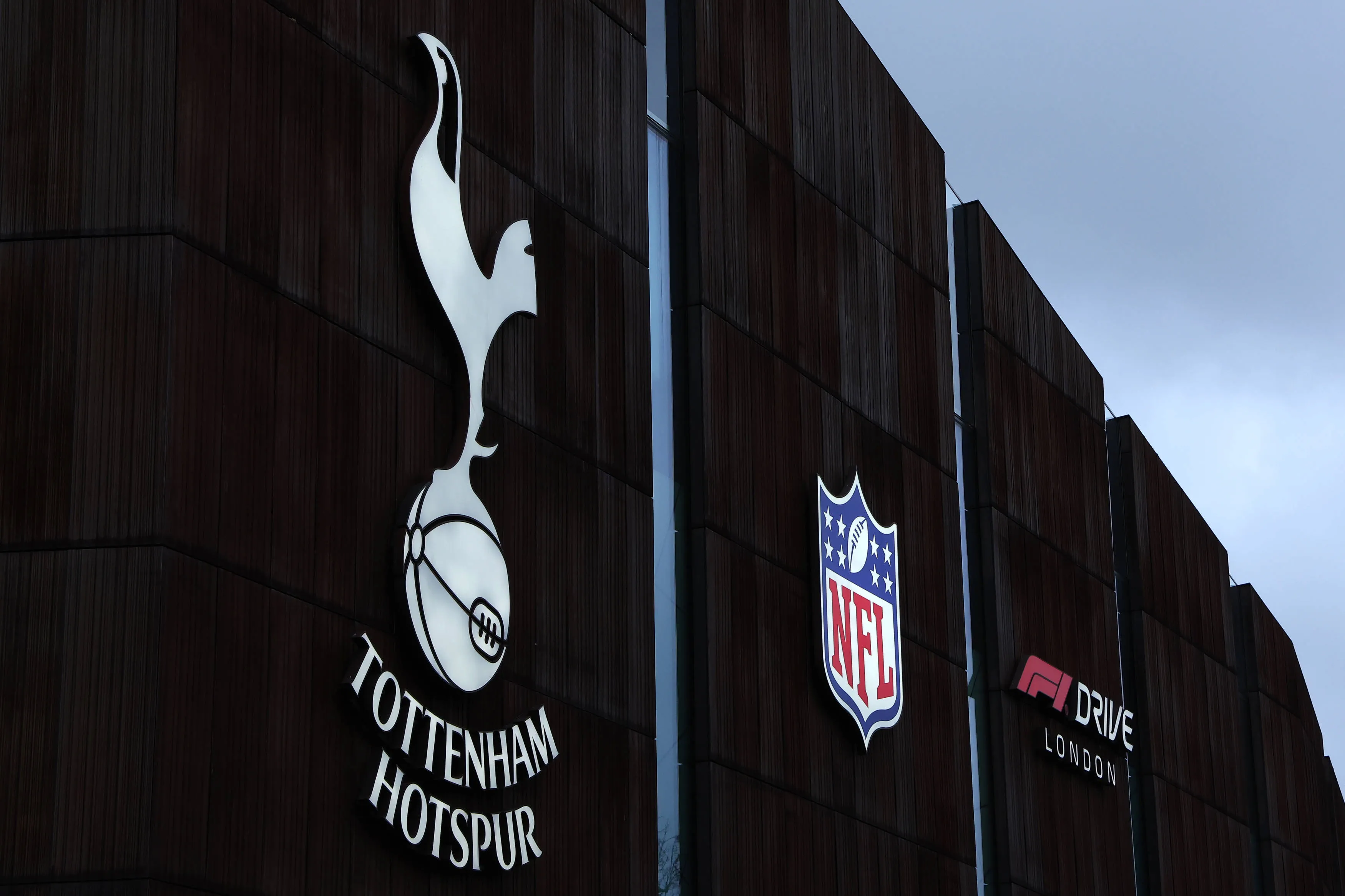 Tottenham Hotspur, NFL, Formula One branding displayed outside Tottenham Hotspur Stadium