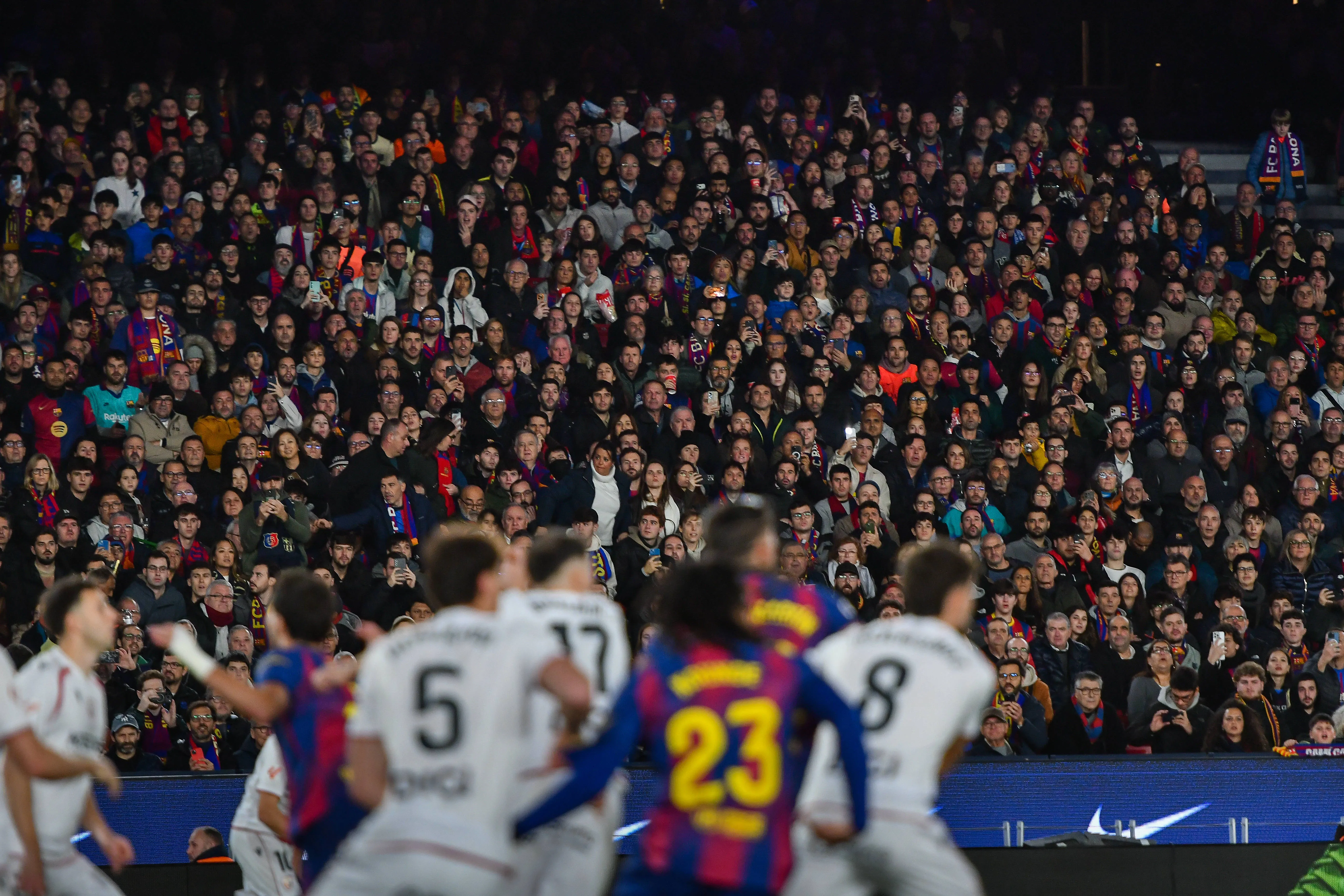 Barcelona fans watch on at the Camp Nou