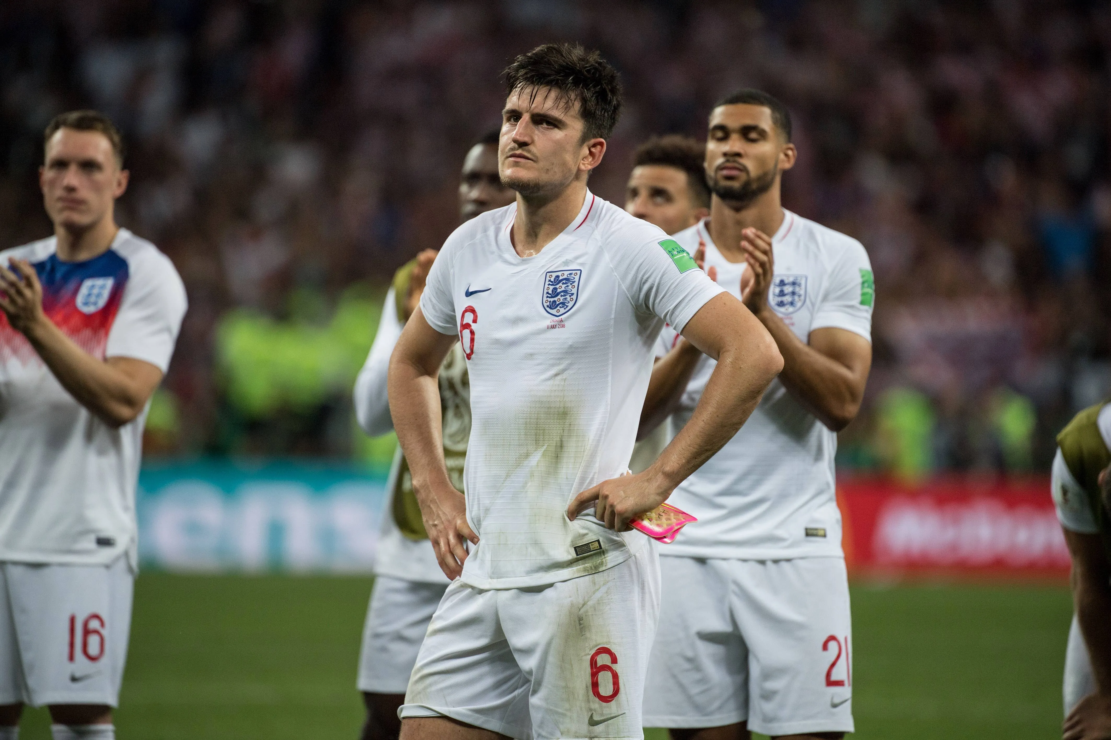Harry Maguire and England teammates are dejected after losing to Croatia at Russia 2018