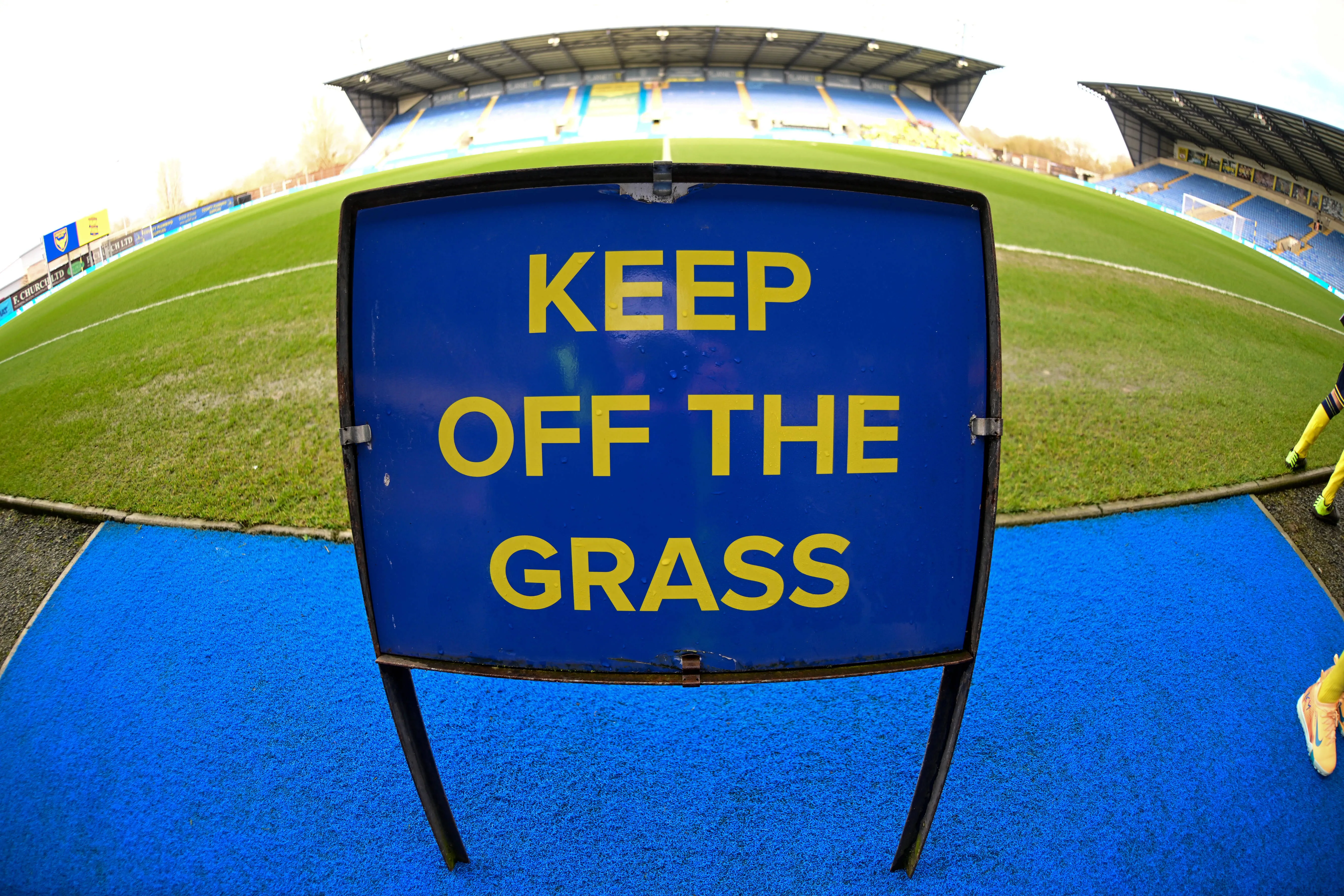 The Kassam Stadium keep off the grass sign