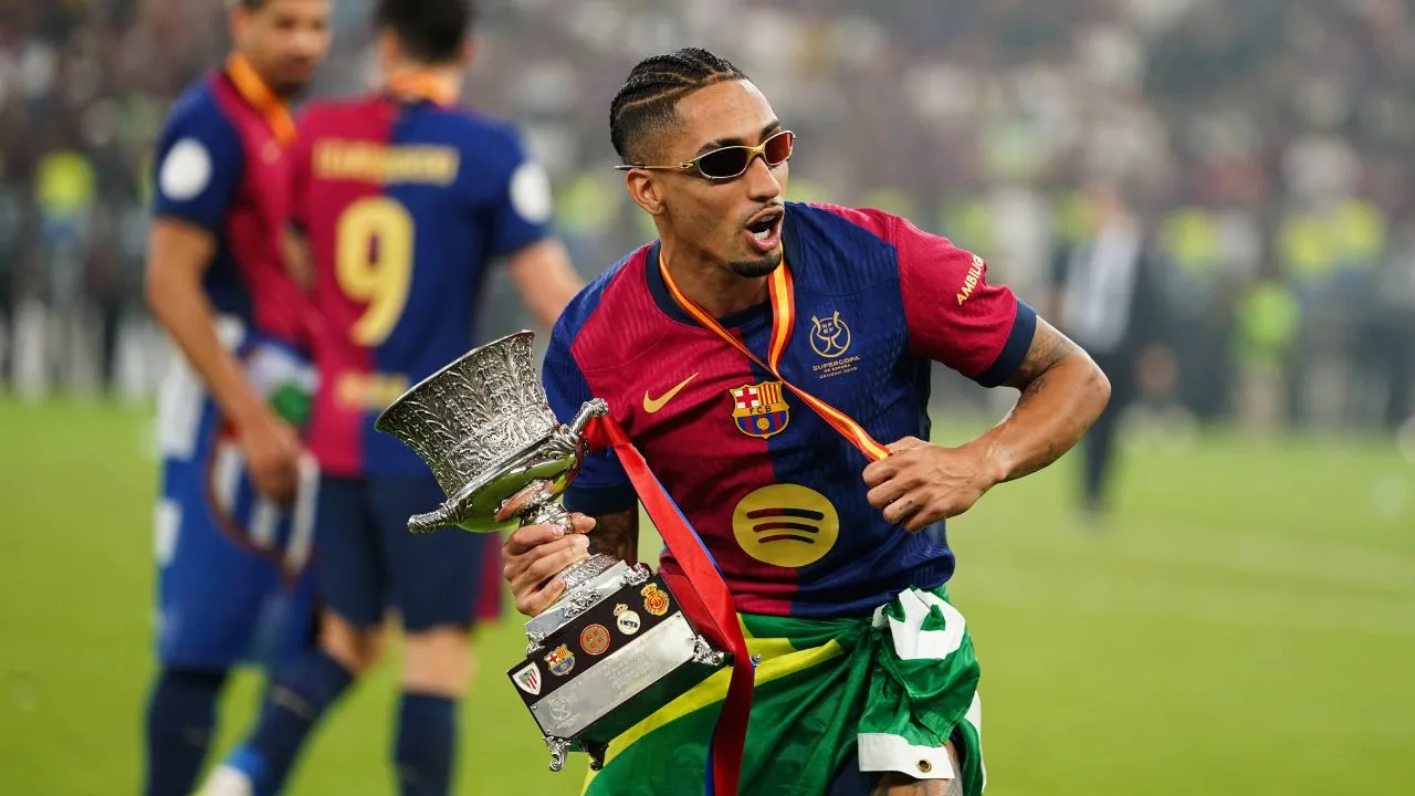 Barcelona's Raphinha celebrates with the Spanish Super Cup