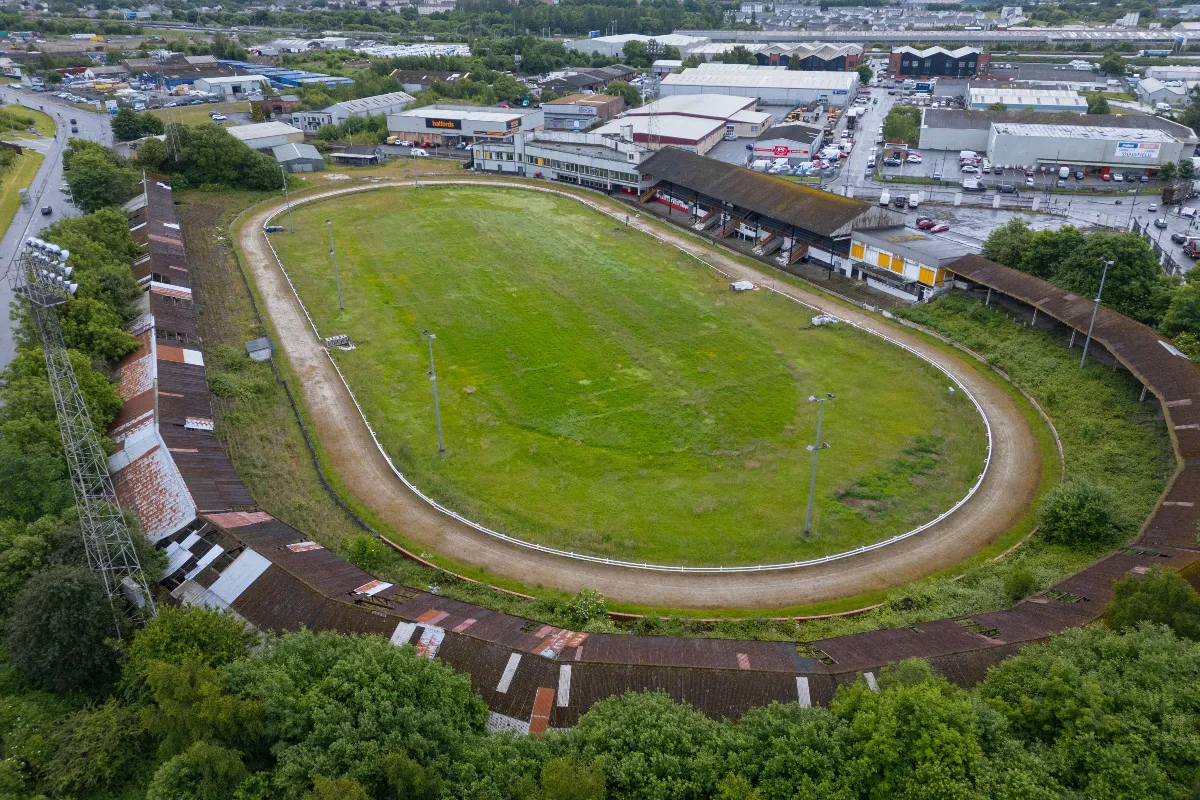 2XDH3AP Aerial view of abandoned closed down former greyhound racing rack and stadium at Shawfield in Glasgow, Scotland, UK