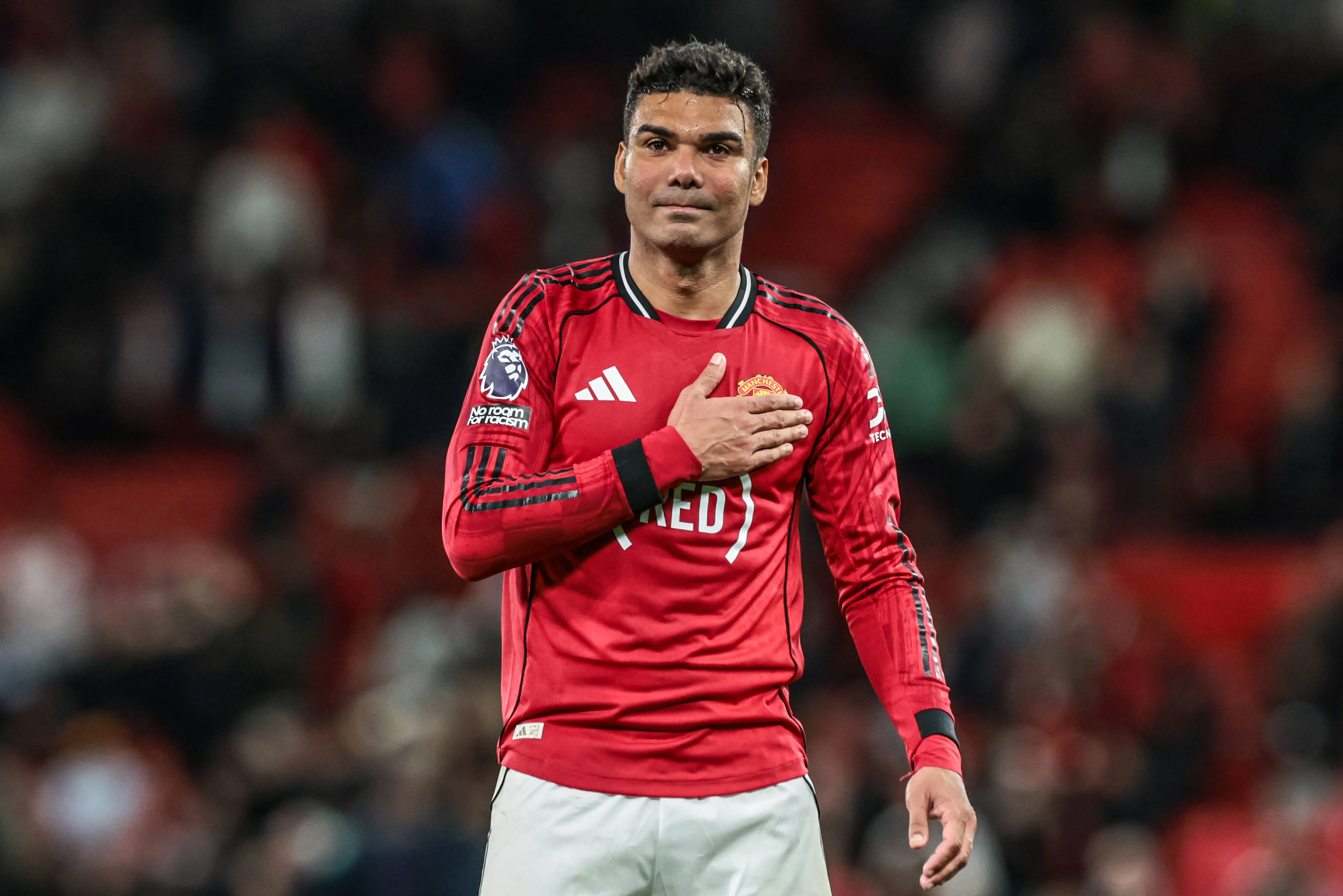 Casemiro of Man Utd celebrates with fans after beating Brentford at Old Trafford