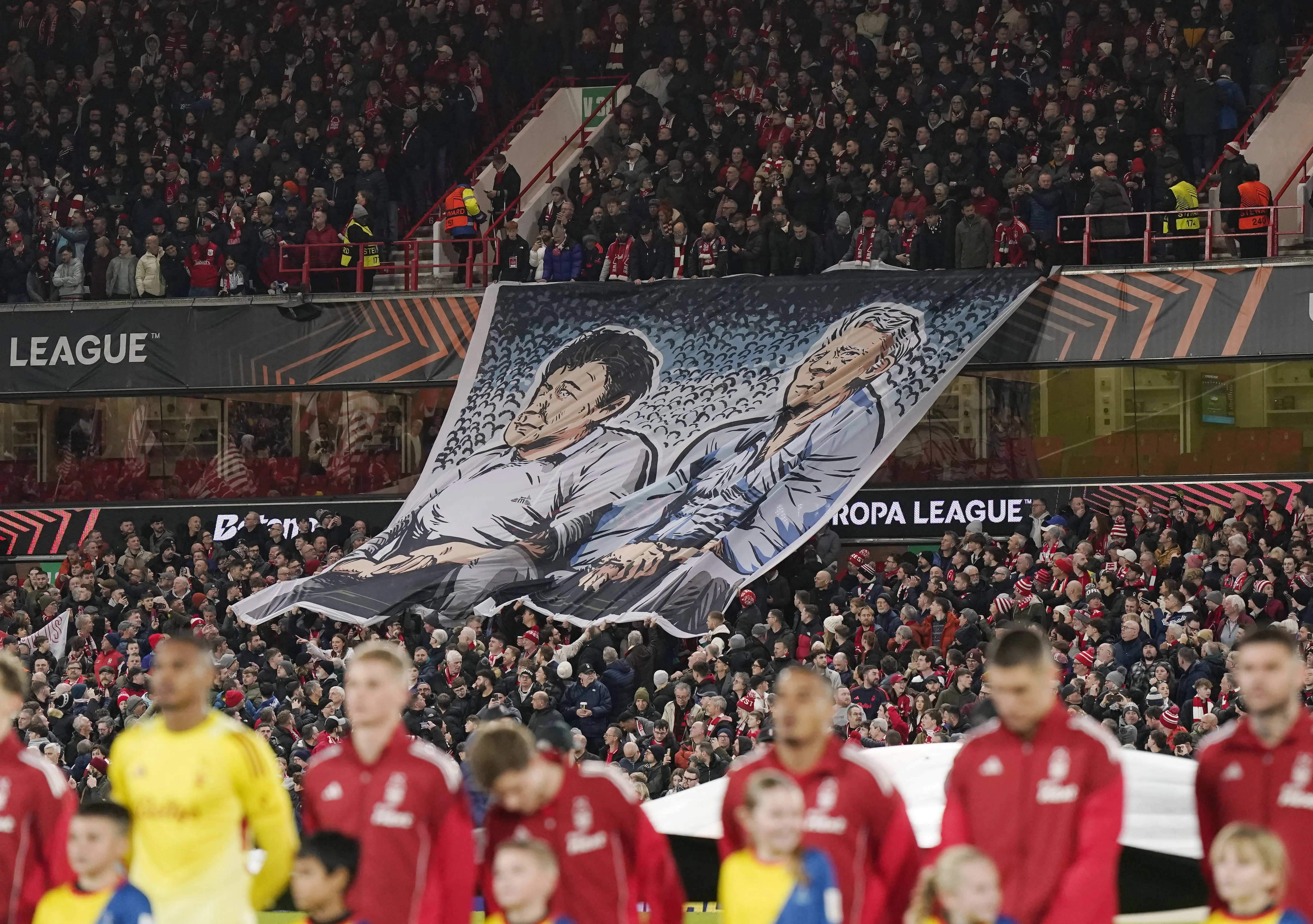Former Forest managership duo of Brian Clough and Peter Taylor are displayed on a banner vs Malmo