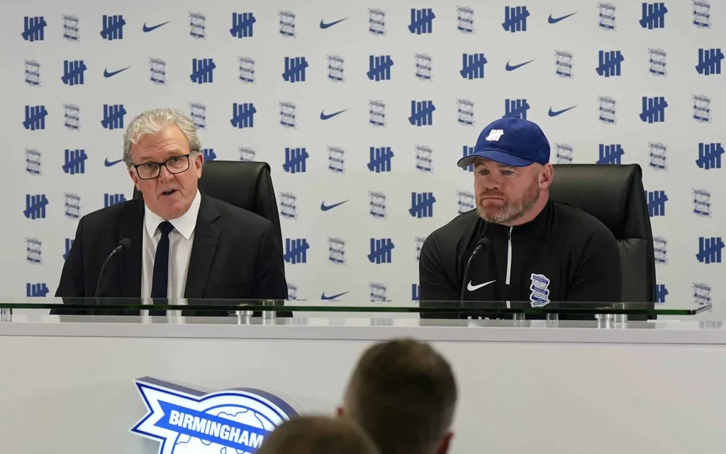 Garry Cook, CEO of Birmingham City unveils Wayne Rooney as manager in October.