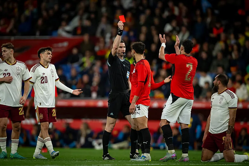 The referee show a red card to Hamdi Fathi of Egypt during a friendly match between Spain and Egypt at RCDE Stadium
