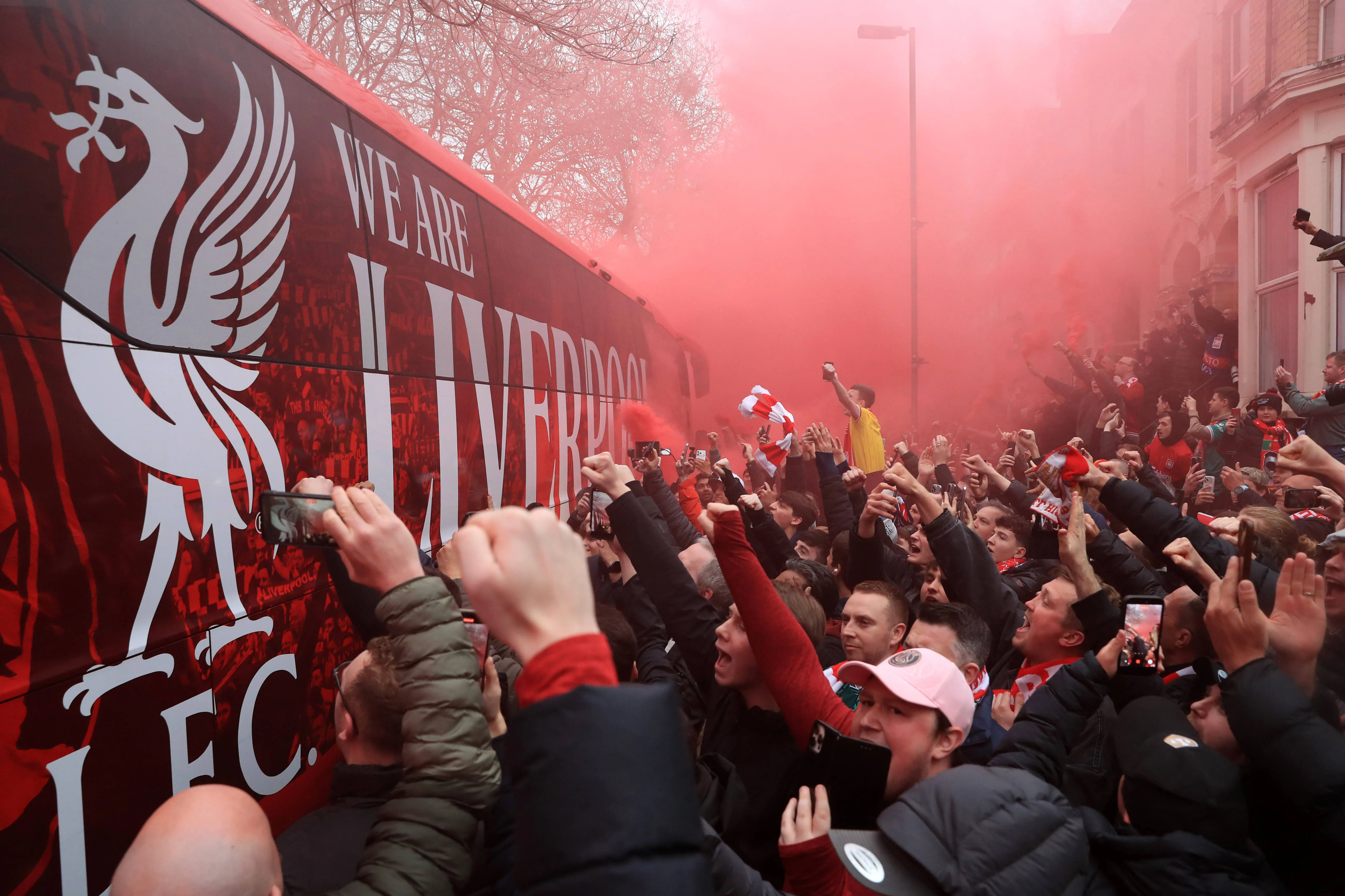 Liverpool fans welcome the team bus on Anfield Road