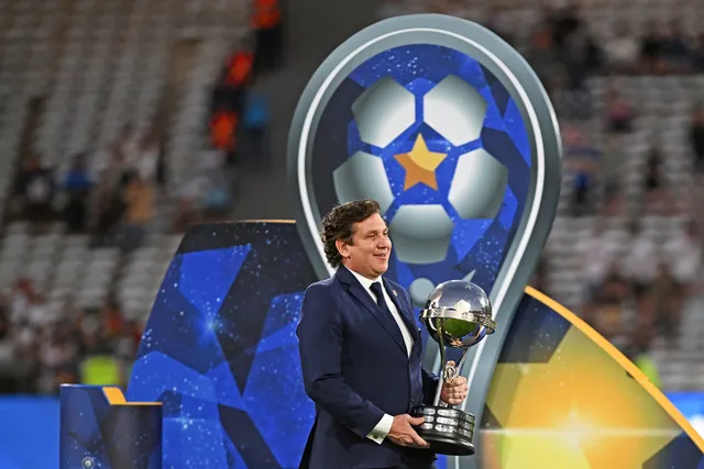 Alejandro Dom&iacute;nguez with the Copa Sudamericana trophy | President of CONMEBOL who are building Estadio CONMEBOL for the 2030 World Cup