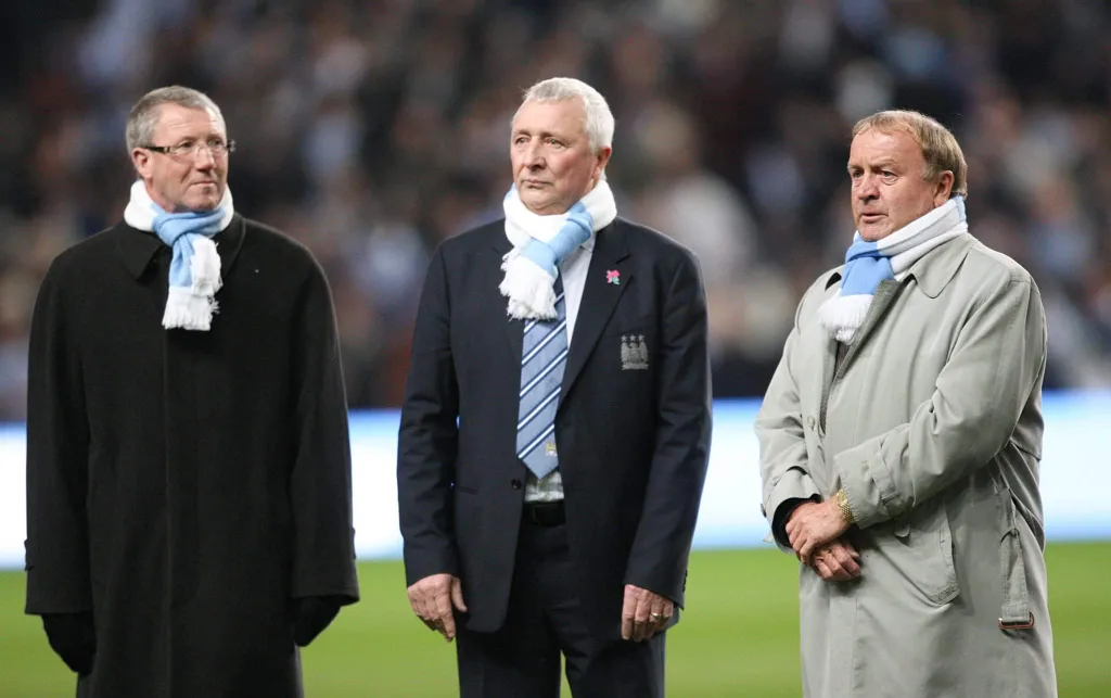 Colin Bell, Mike Summerbee and Francis Lee together back in 2010 at the Etihad Stadium with Manchester City scarves | The club legends will now be commemorated in a new Manchester City statue to be unveiled on Tuesday 28 November