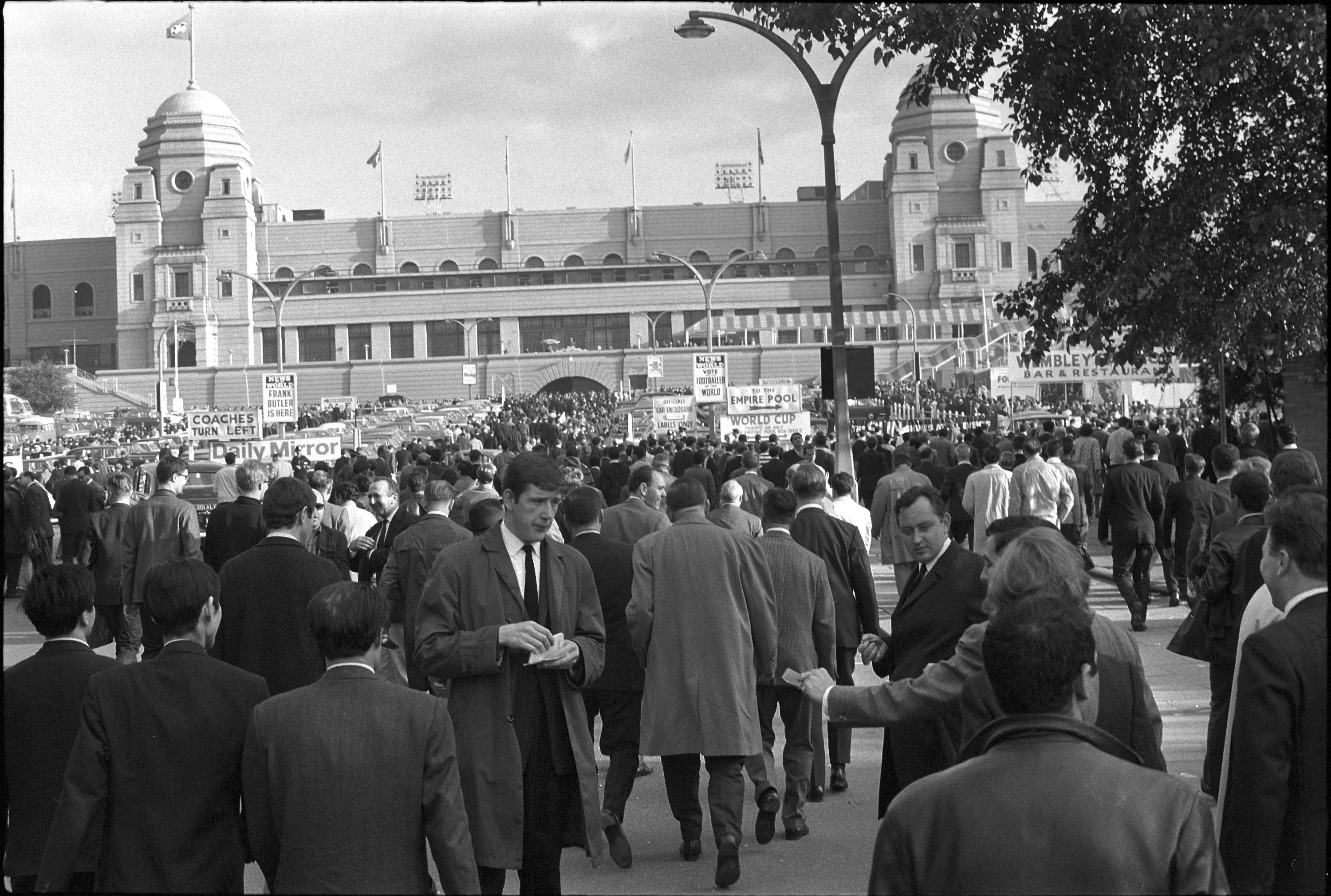 Fans arrive at the original Wembley Stadium for the 1966 World Cup final between England and West Germany