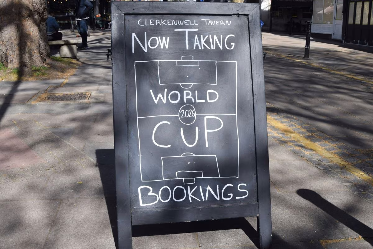 A sign outside a bar advertises bookings for the 2026 World Cup