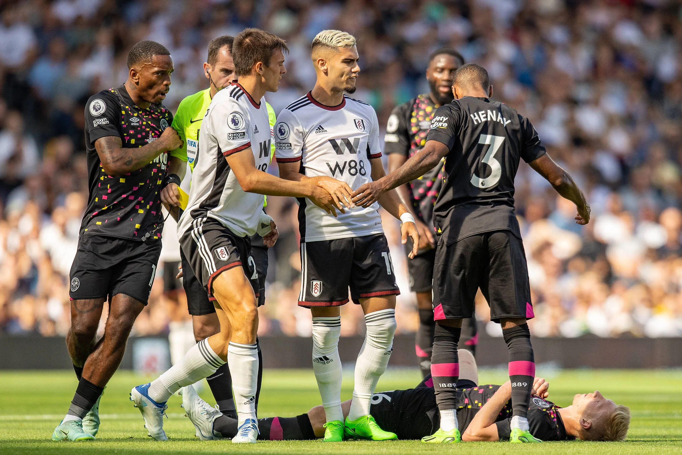 Fulham and Brentford players clash at Craven Cottage