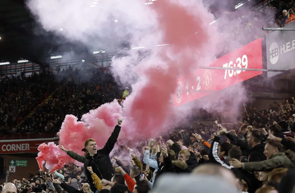 A flare is set off as Manchester United's fans celebrate their sides second goal of the game during the Premier League match at Bramall Lane, Sheffield. Picture date: Saturday October 21, 2023. - Photo by Icon sport