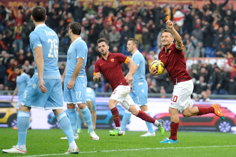Roma legend Francesco Totti celebrates scoring vs Lazio