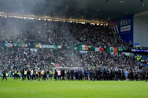 Watch Celtic and Rangers fans storm pitch after Old Firm derby