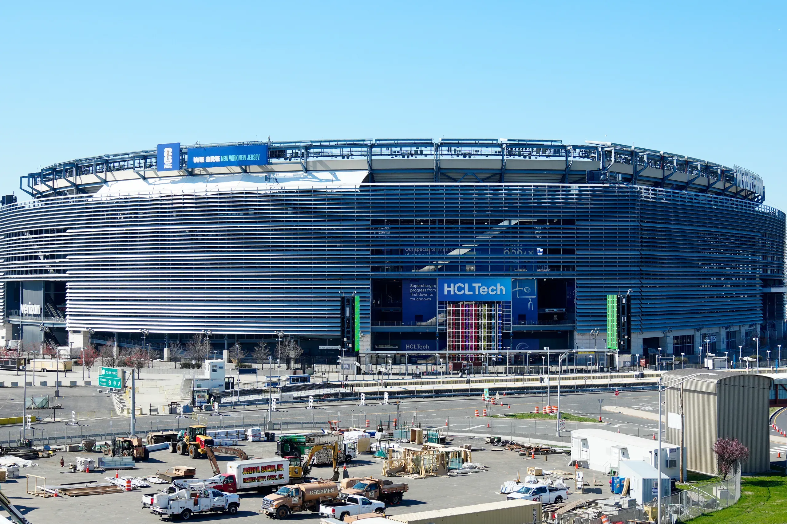 Covers draped over MetLife Stadium's old signage in preparations for the 2026 World Cup
