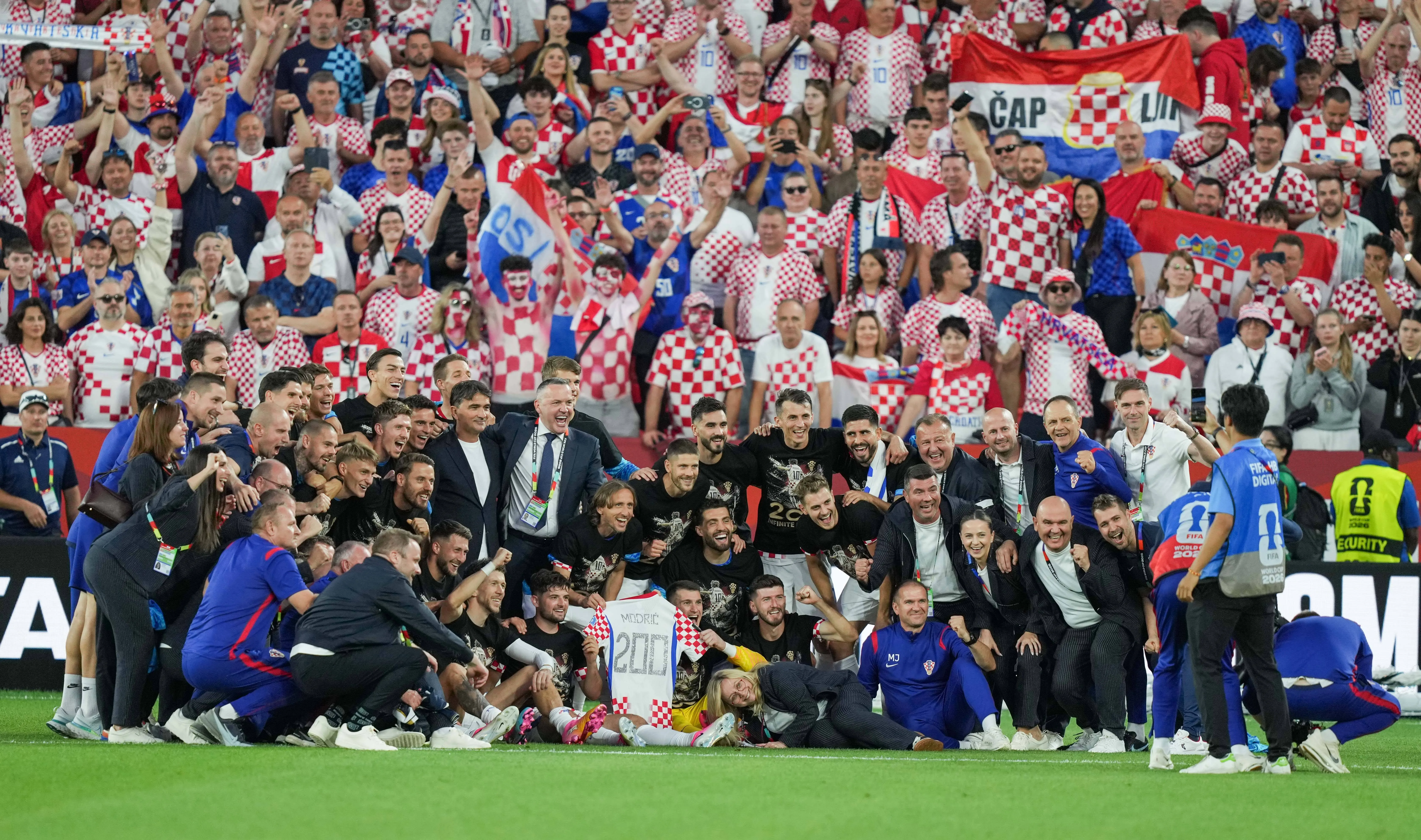 Croatia staff and players celebrate Luka Modric's 200th game after beating Panama at BMO Field