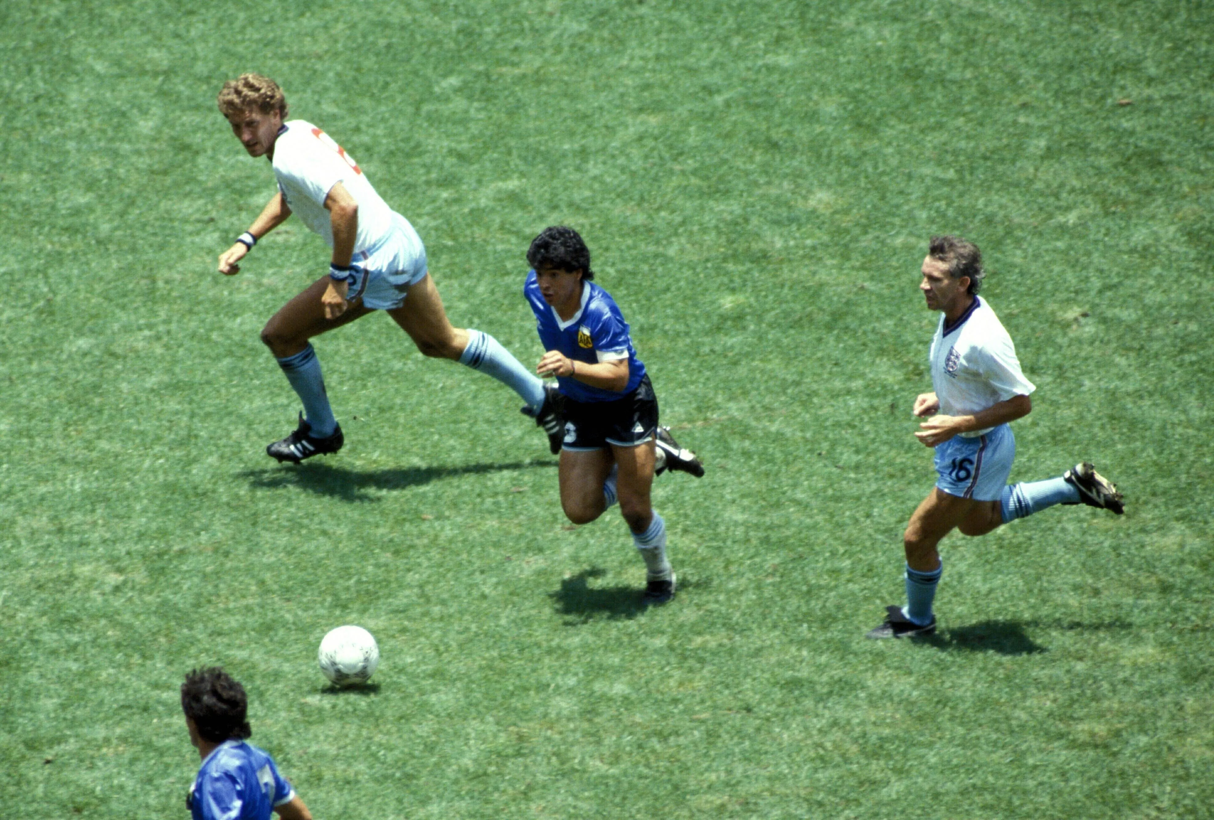 Argentina's Diego Maradona goes past England's Terry Butcher at the Estadio Azteca in 1986