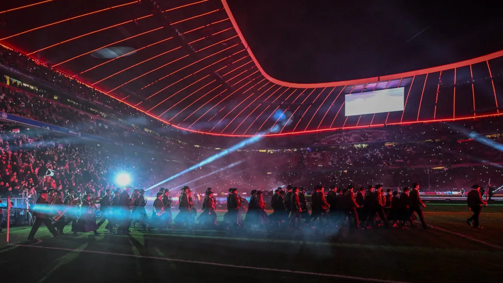 17 December 2023, Bavaria, Munich: Soccer: Bundesliga, Bayern Munich - VfB Stuttgart, Matchday 15, Allianz Arena. After the match, a traditional band enters the pitch.